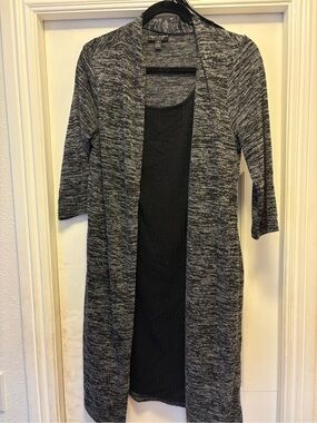 Black dress with attached cardigan and belt size 10